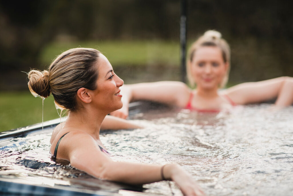 Friends enjoying a clean, well-maintained hot tub